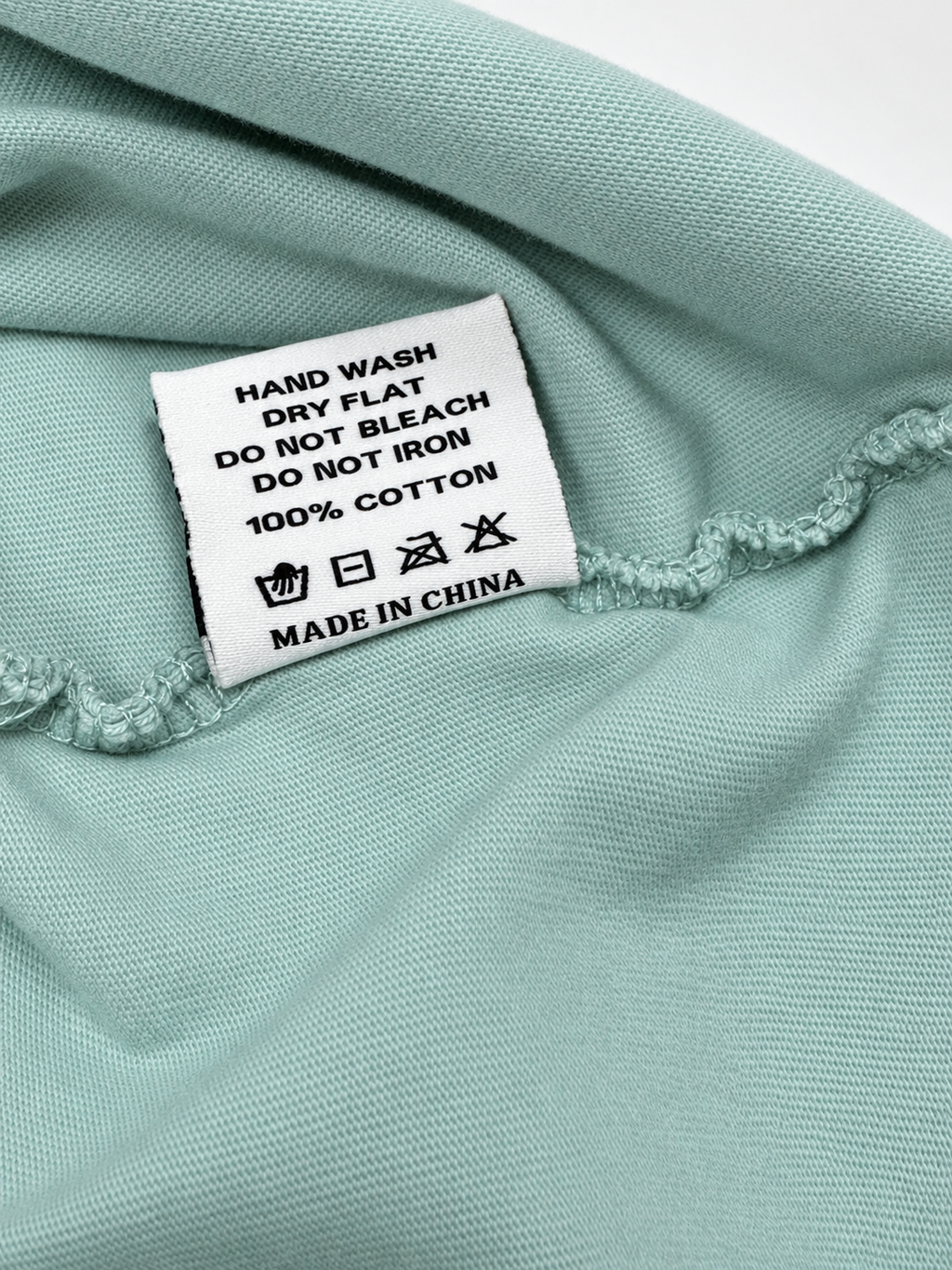 Close-up view of printed graphic detail on mint Bruce Lee T-shirt