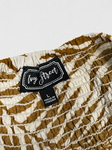 Ivy Street ivory olive palm print jumpsuit brand and size label detail