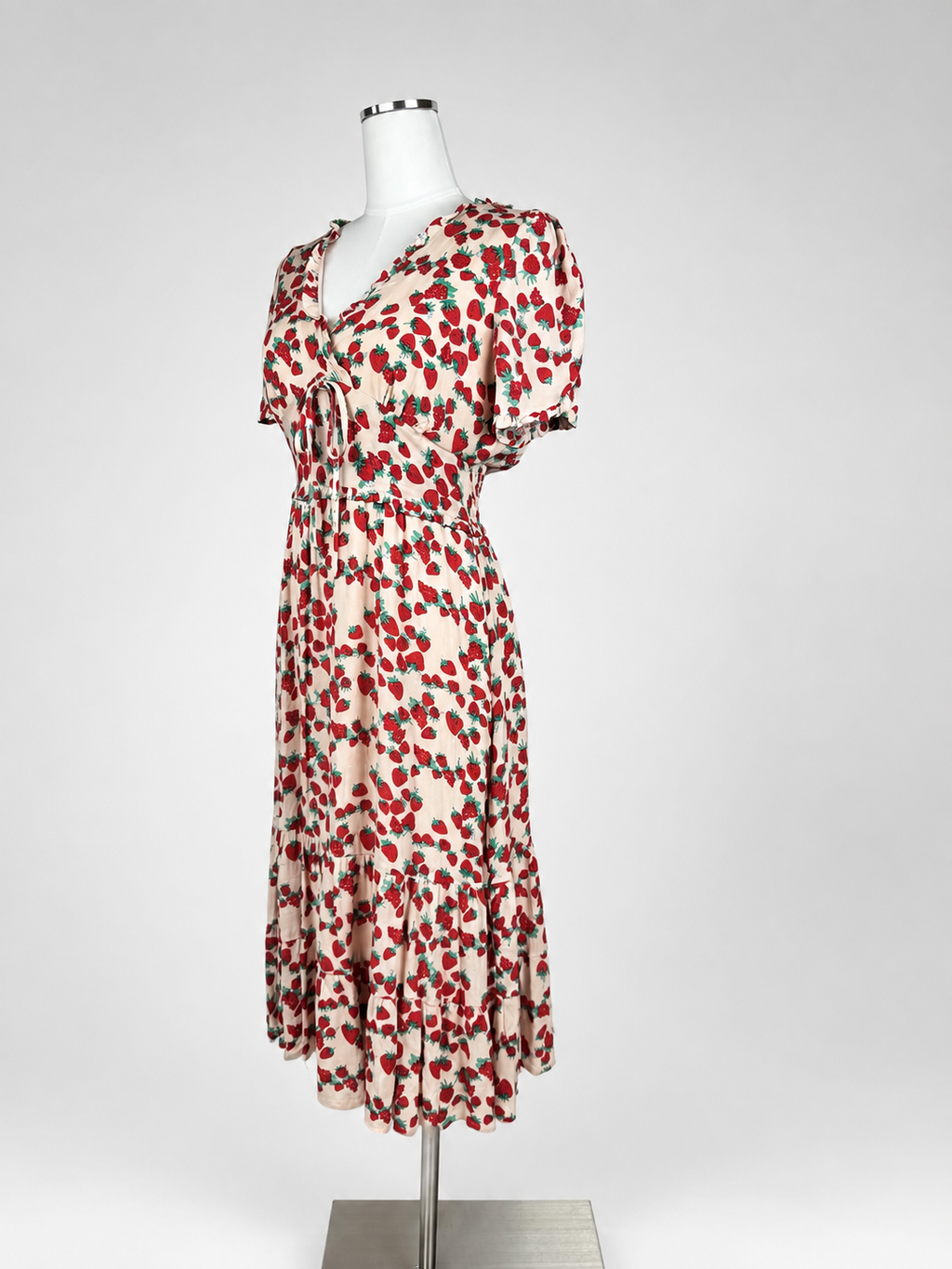 Betsey Johnson strawberry print midi dress front view showing puff sleeves and tie front