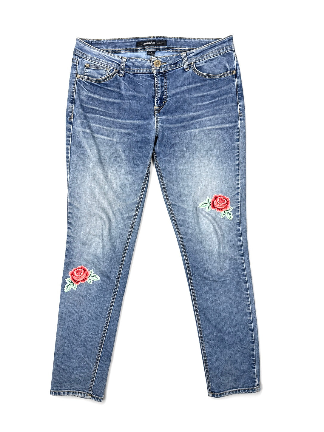 Jordache skinny jeans waistband, button, and zip fly detail