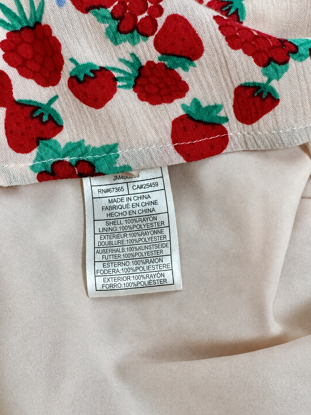 Betsey Johnson strawberry print dress neckline and tie-front detail