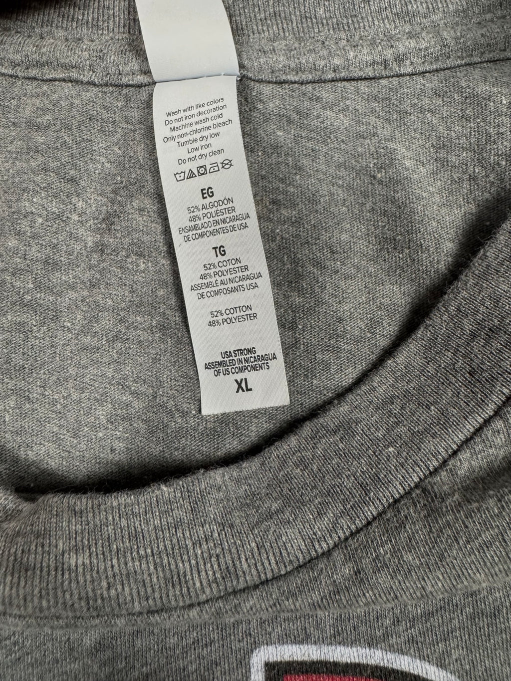 Care label showing 52 percent cotton and 48 percent polyester inside heather-gray T-shirt
