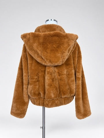 Back of LUSH copper faux fur jacket on a mannequin, showing the attached hood, long sleeves and banded hem.