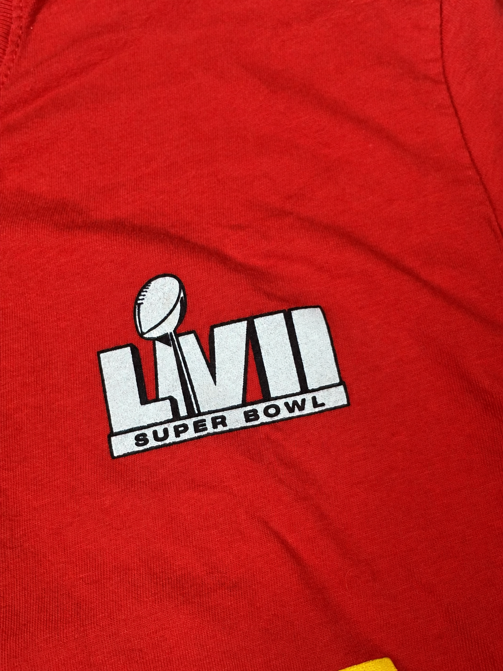 Close-up view of Super Bowl LVII trophy graphic on red Nike T-shirt