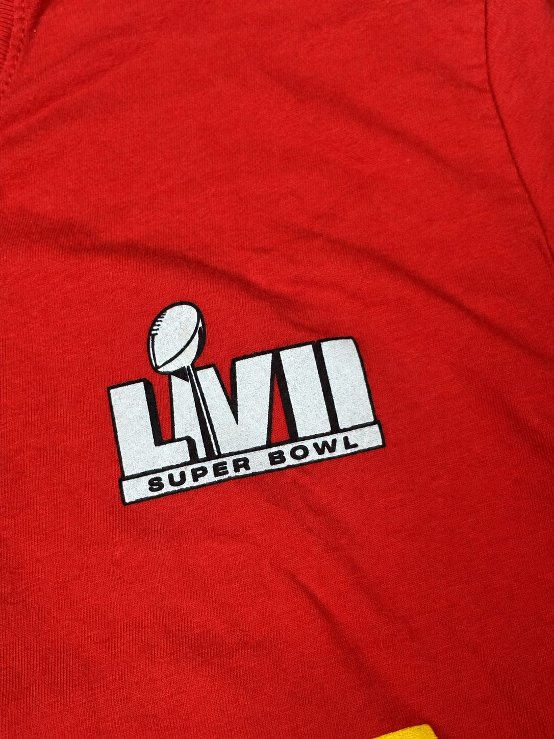 Close-up view of Super Bowl LVII trophy graphic on red Nike T-shirt
