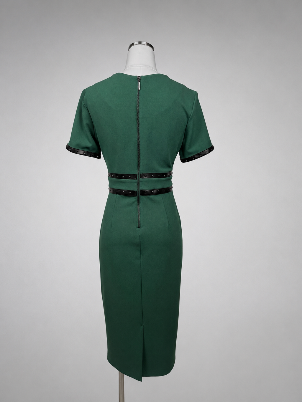 Close-up of black stud trim detail on Joseph Ribkoff emerald green dress sleeve