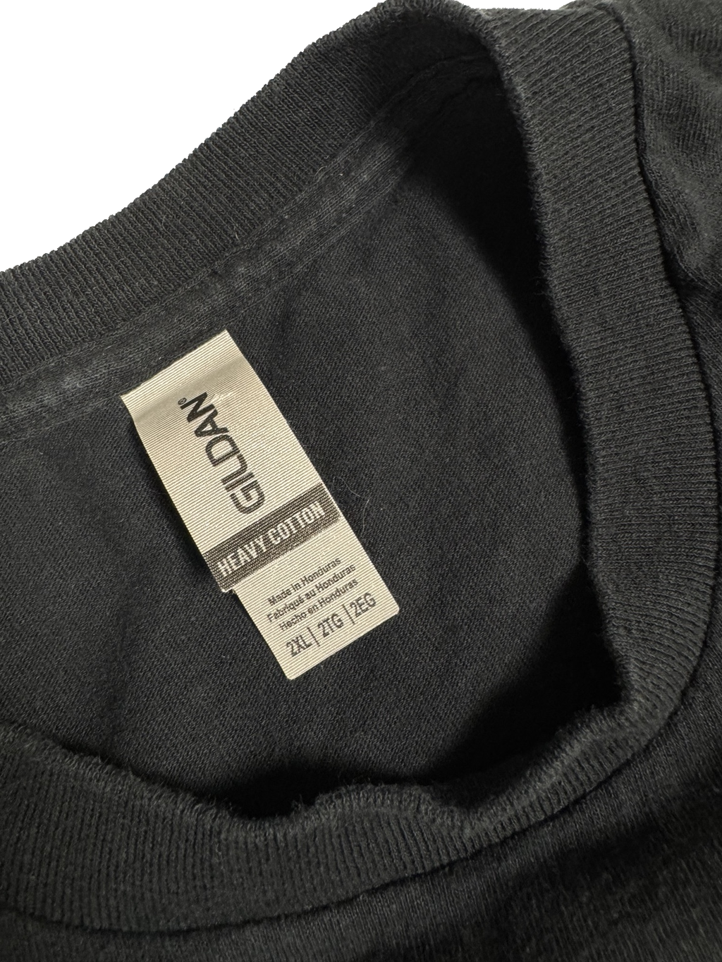 Gildan Heavy Cotton neck label showing 2XL on black graphic T-shirt