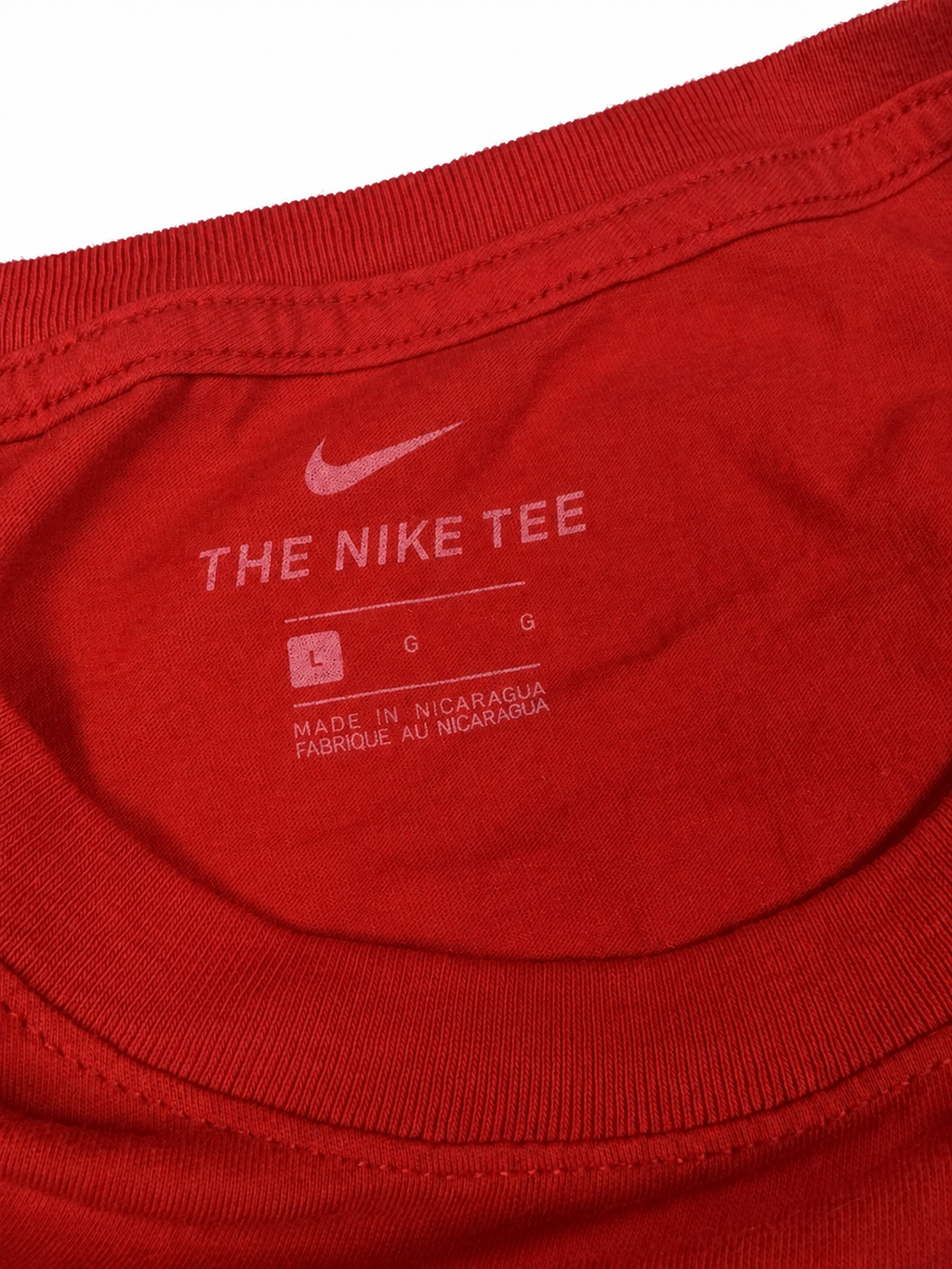 Nike neck label showing Large on red T-shirt