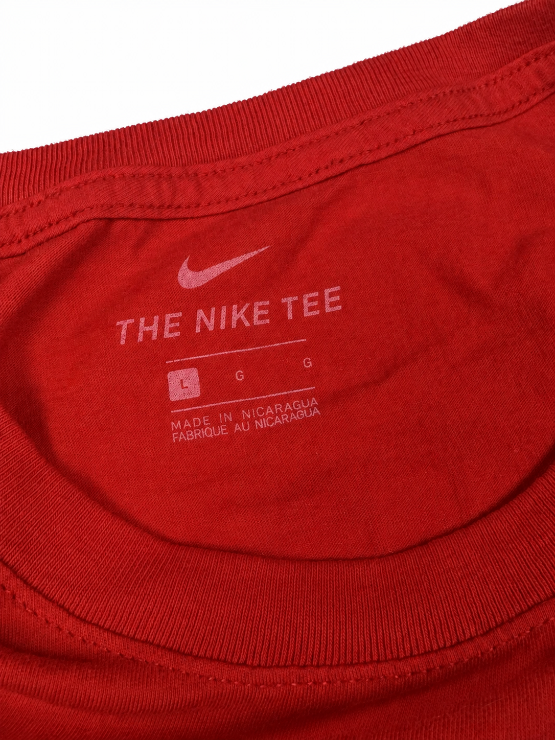 Nike neck label showing Large on red T-shirt