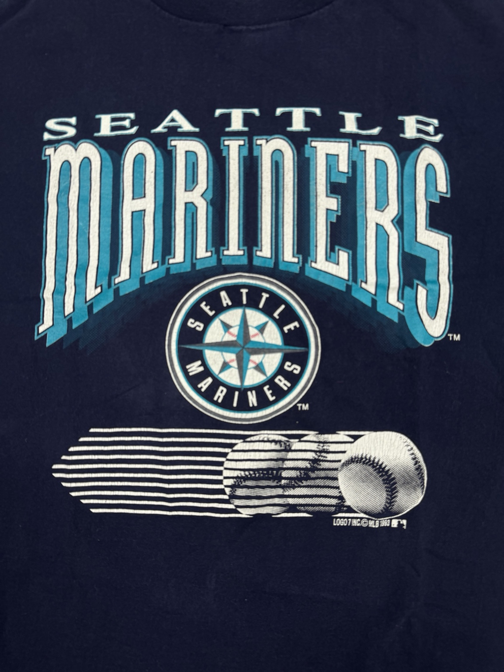 Back view of navy Logo 7 Seattle Mariners T-shirt made in USA