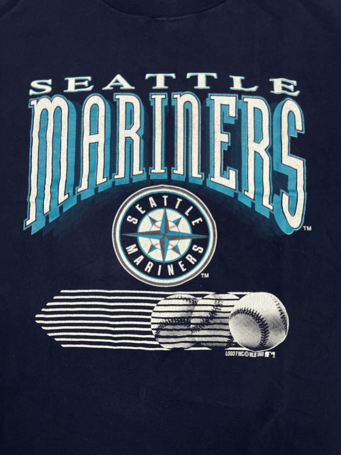 Back view of navy Logo 7 Seattle Mariners T-shirt made in USA
