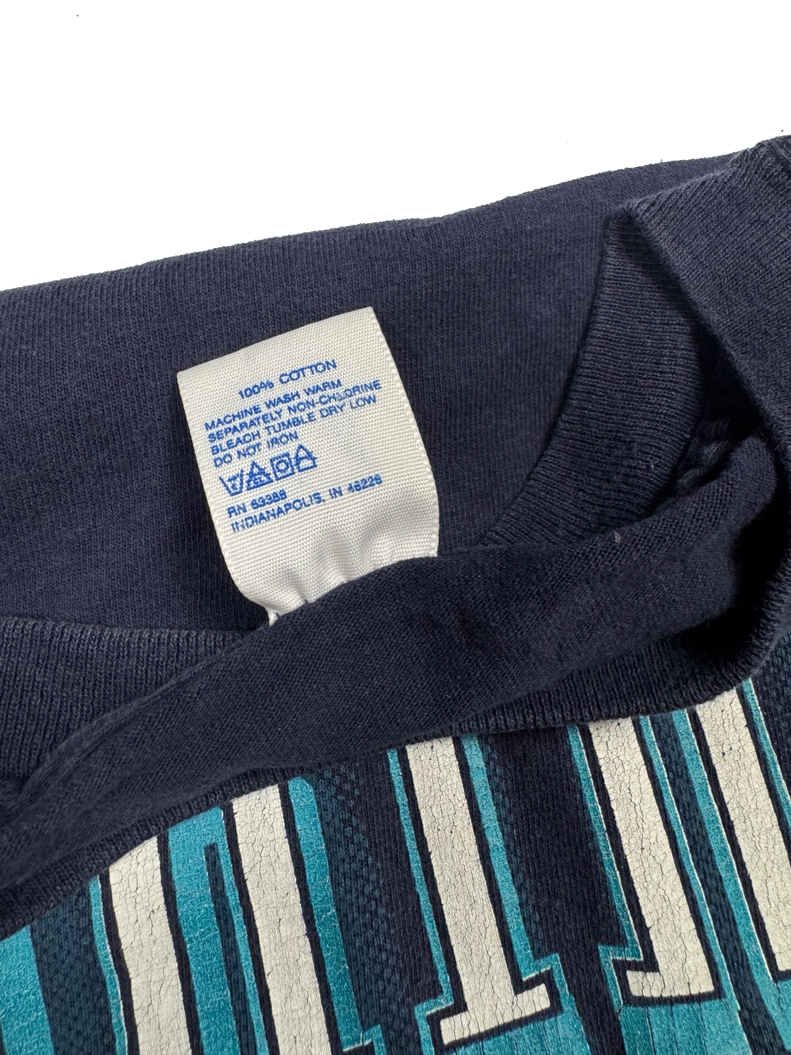 Close-up view of printed Seattle Mariners lettering on navy Logo 7 T-shirt made in USA
