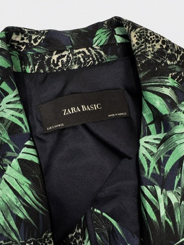 Interior close-up of Zara Basic blazer showing black brand label, EUR S USA S MEX 26 size tag, and navy lining